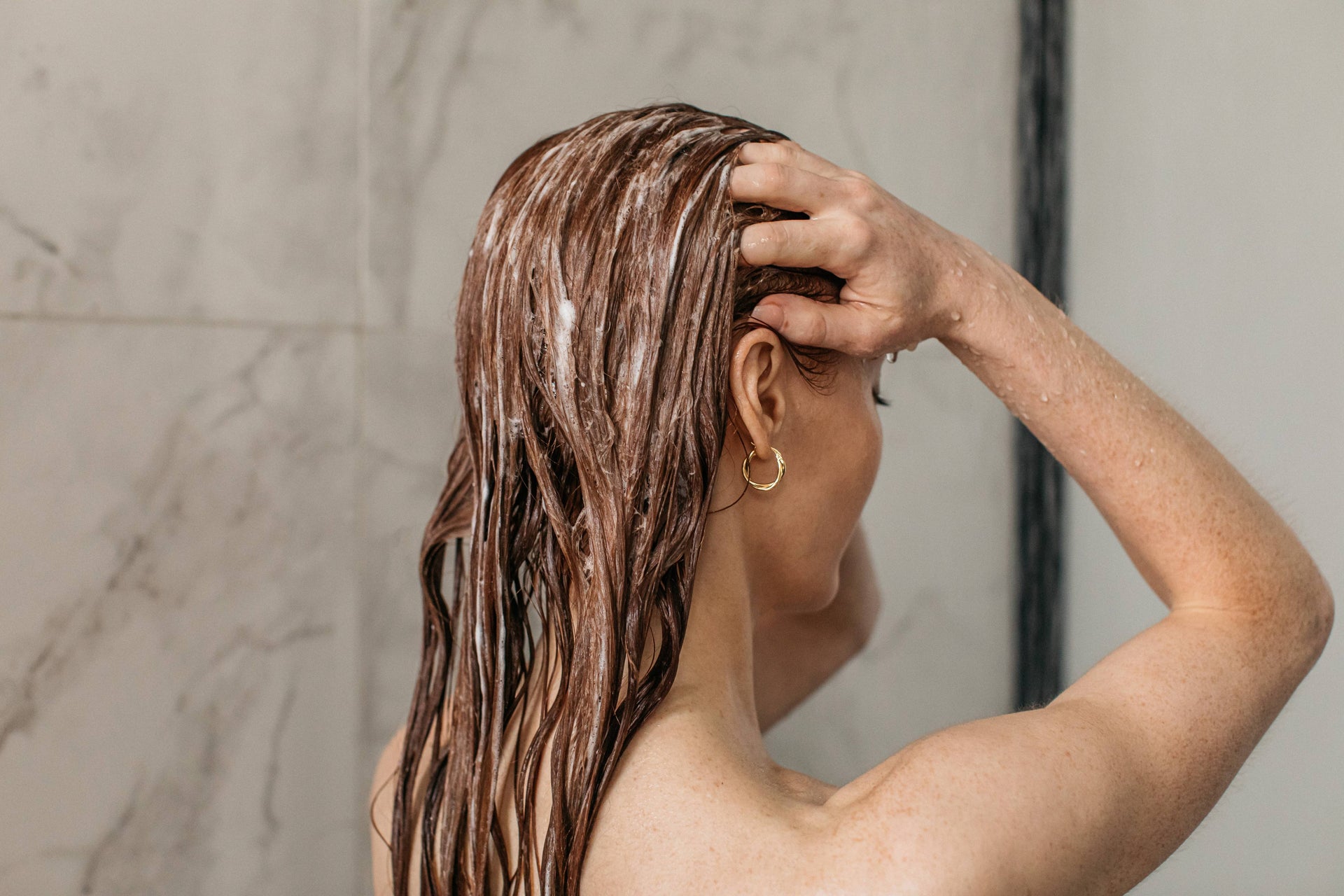 How To Actually Wash Your Hair According To A Trichologist