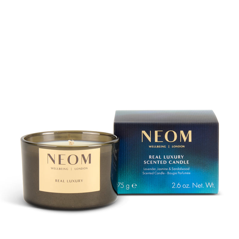 NEOM Real Luxury scented candle with packaging on a white background