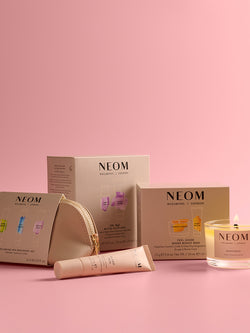 NEOM gift sets on a pink background