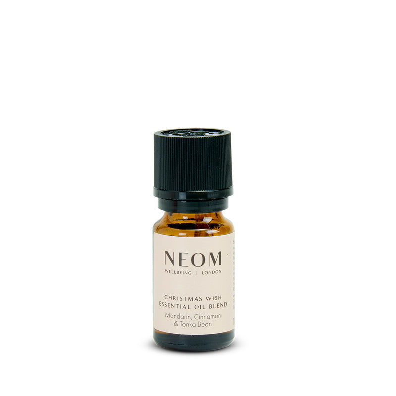 NEOM Christmas Wish essential oil blend bottle on a white background