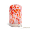 NEOM diffuser with a pink and orange pattern on a white background