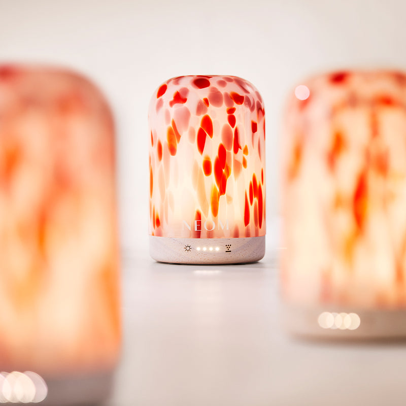 NEOM diffuser with a blurred background