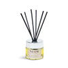 NEOM reed diffuser with black reeds on a white background