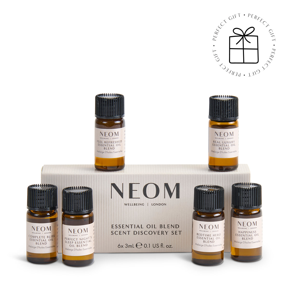 NEOM essential oil blend scent discovery set with six small bottles on a white background with a Perfect Gift roundel with a present