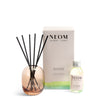 NEOM  diffuser set with bottle, vase, and packaging on a white background