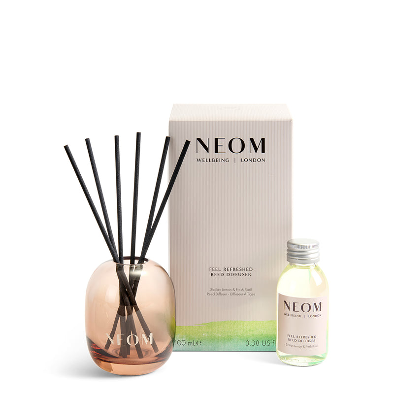 NEOM  diffuser set with bottle, vase, and packaging on a white background
