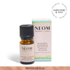 NEOM Grapefruit, mandarin and eucalyptus essential oil blend on a white background with subscription roundel