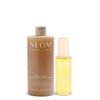 NEOM great day body wash and dry body oil on a white background