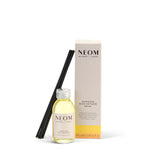 NEOM  happiness reed diffuser set with bottle, sticks, and box on a white background