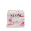 NEOM scented candle box with floral design on a white background