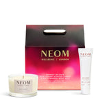 NEOM candle, body milk, and packaging on a white background