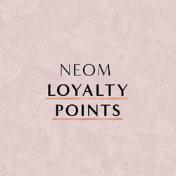 Text 'NEOM LOYALTY POINTS' on a light pink background