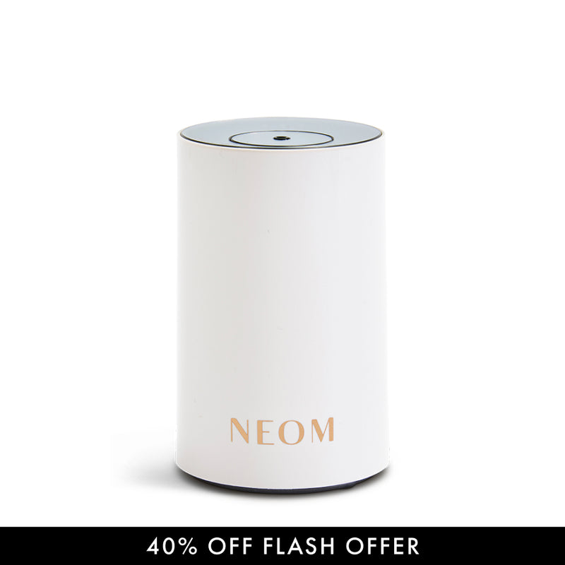White Pod Mini Diffuser with 'NEOM' branding on a light gray background