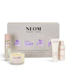 NEOM sleep wellbeing collection with various products on a white 