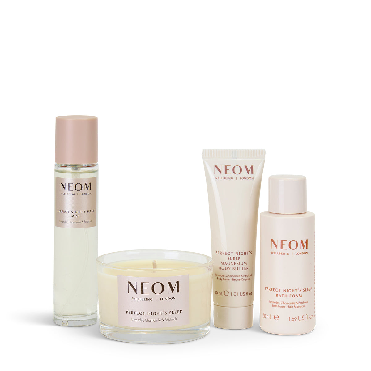 NEOM Sleep products including a candle, bath foam, body butter and pillow mist on a white background