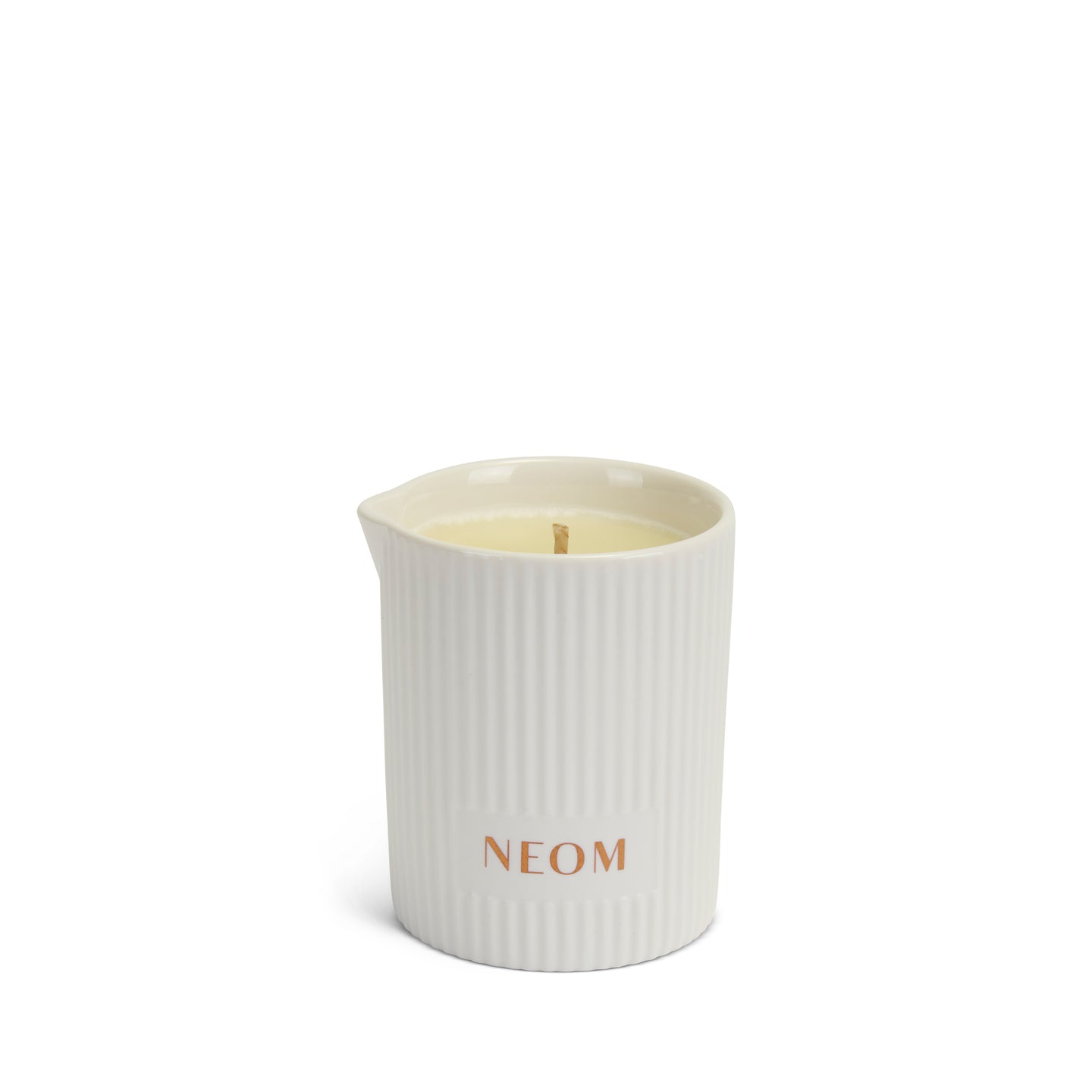 NEOM White ribbed massage candle with 'NEOM' branding on a white background