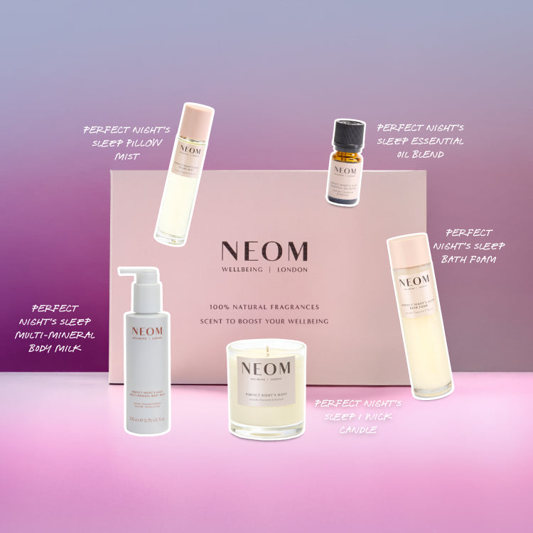NEOM Wellbeing products including candles, bottles, and a box on a pink and purple gradient background.