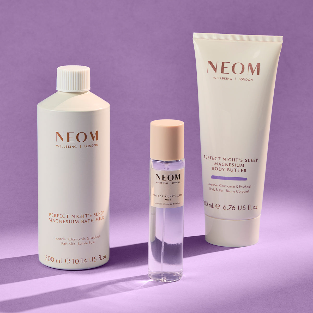 NEOM skincare products on a purple background