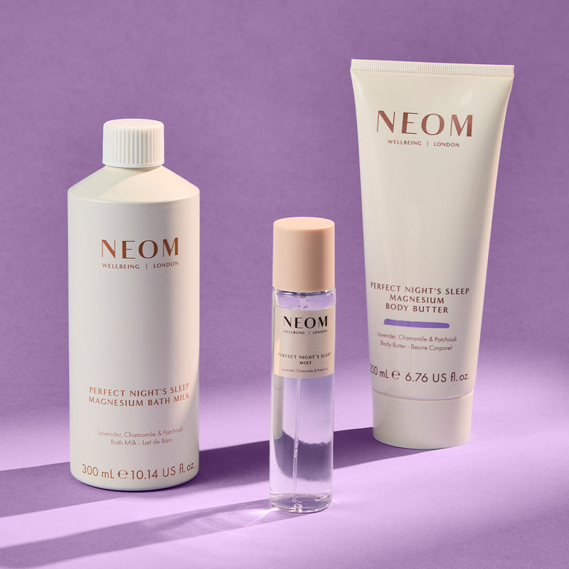 NEOM skincare products on a purple background
