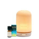 NEOM diffuser and essential oil on a white background