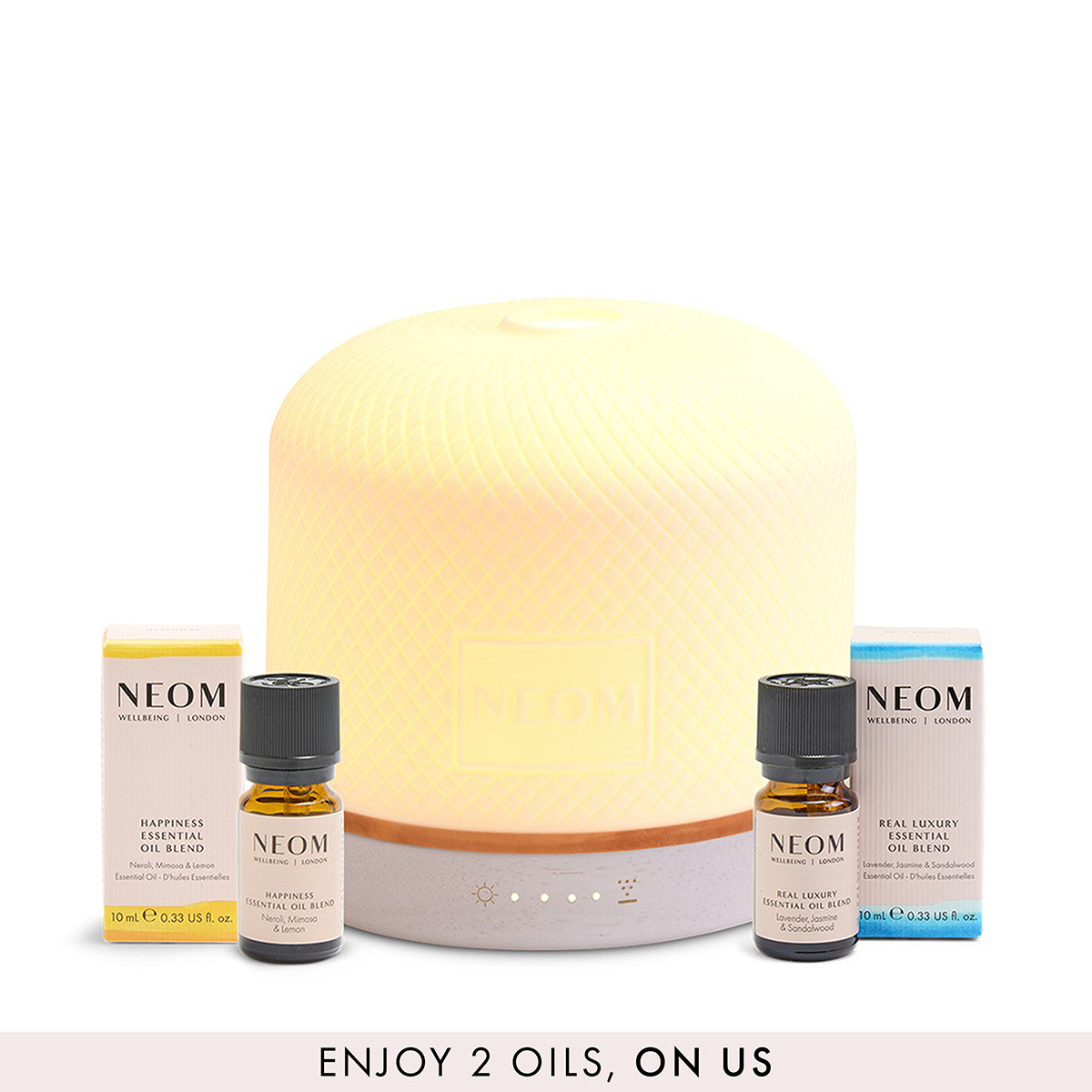 NEOM pod luxe bundle with 2 free essential oil blends on a white background