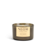 NEOM real luxury candle with a gold label on a white background