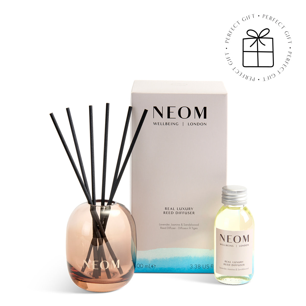 NEOM diffuser set with bottle, diffuser sticks, and packaging on a white background