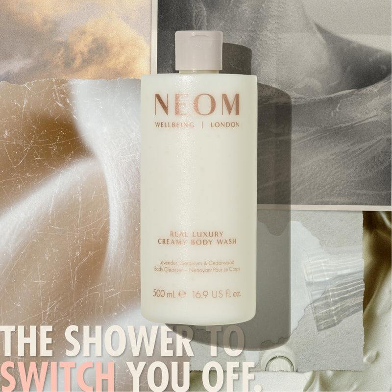 “NEOM Real Luxury Creamy Body Wash bottle over a collage of soft, calming textures. Text reads: ‘The shower to switch you off.’”