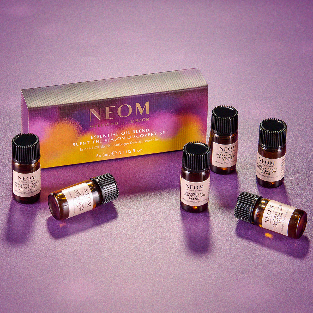 NEOM essential oil blend set on a purple background