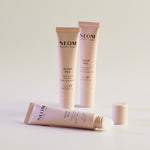 Three NEOM Sleep Pen tubes on a light background