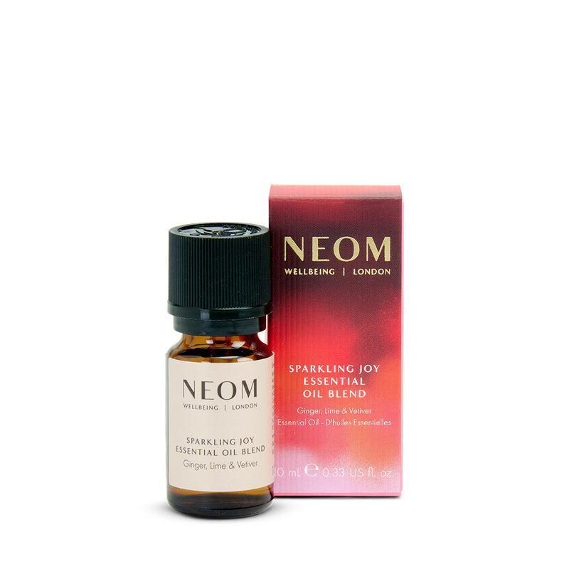 Neom Sparkling Joy essential oil blend bottle and packaging on a white background