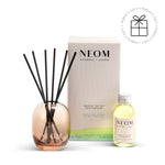 NEOM reed diffuser with vessel and and bottle on a white background