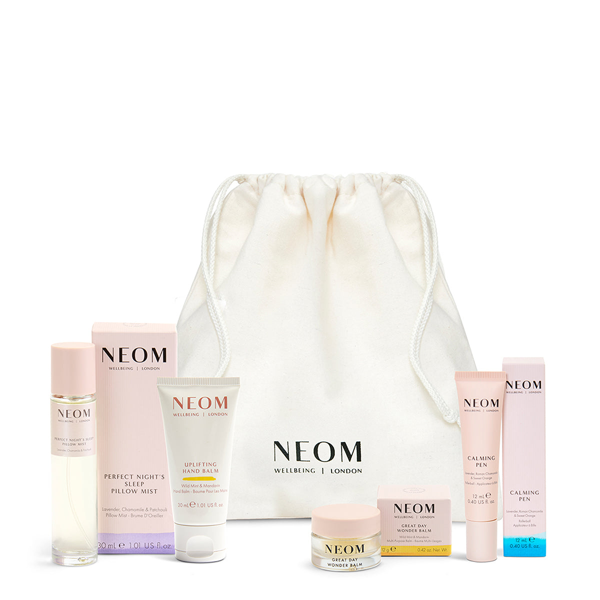 NEOM skincare products with a white drawstring bag on a white background
