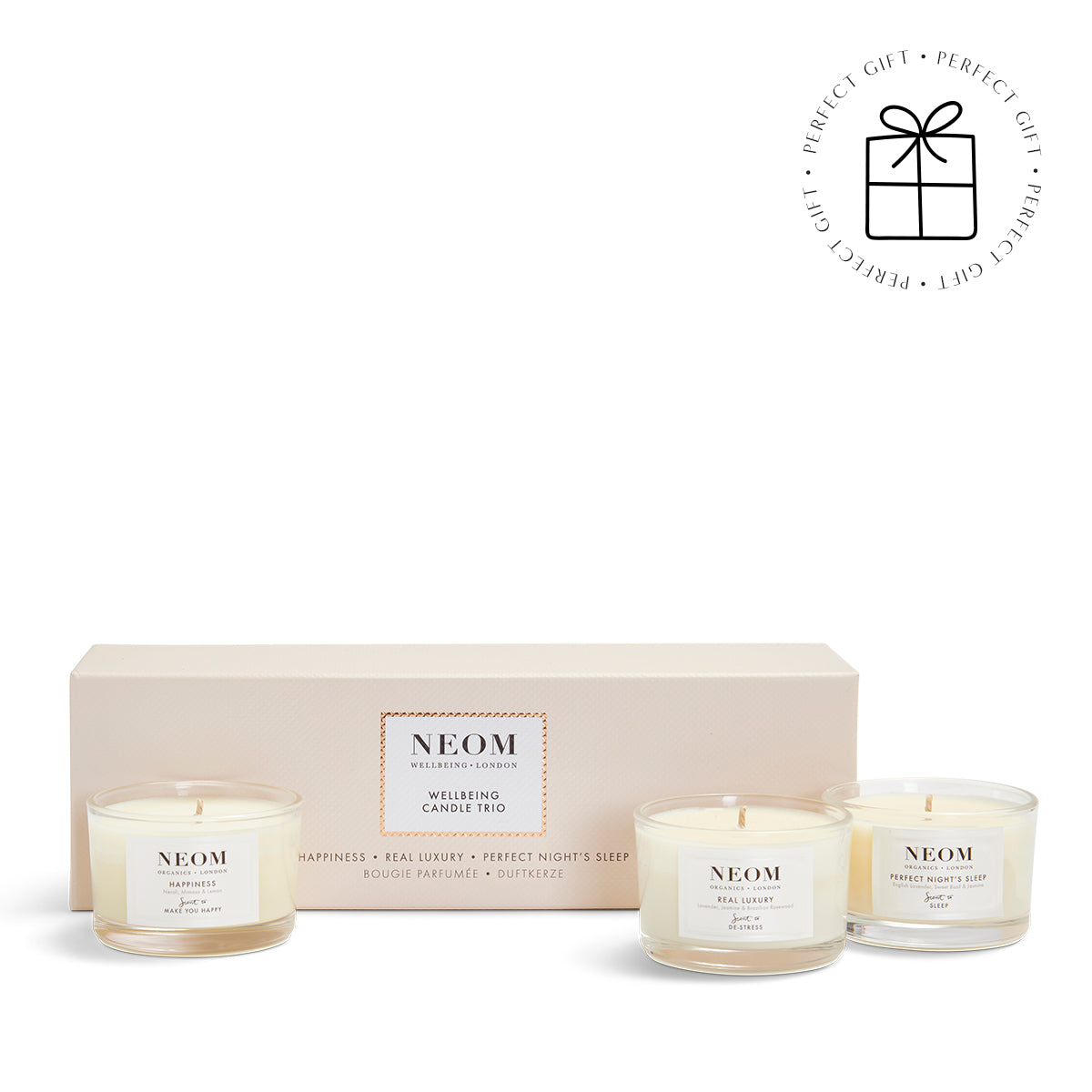 NEOM Wellbeing Candle Trio on a white background with a Perfect Gift Roundel with a present