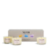 NEOM candle trio with packaging on a white background