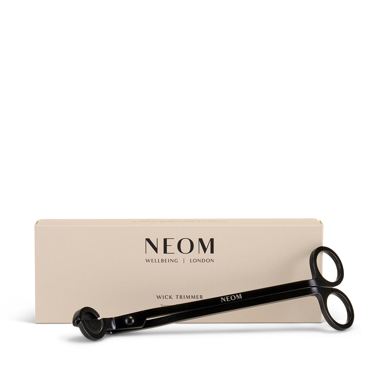 NEOM wick trimmer with packaging on a white background