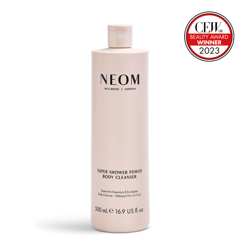 NEOM Super Shower Power Body Cleanser bottle with CEW Beauty Award Winner 2023 badge on a white background