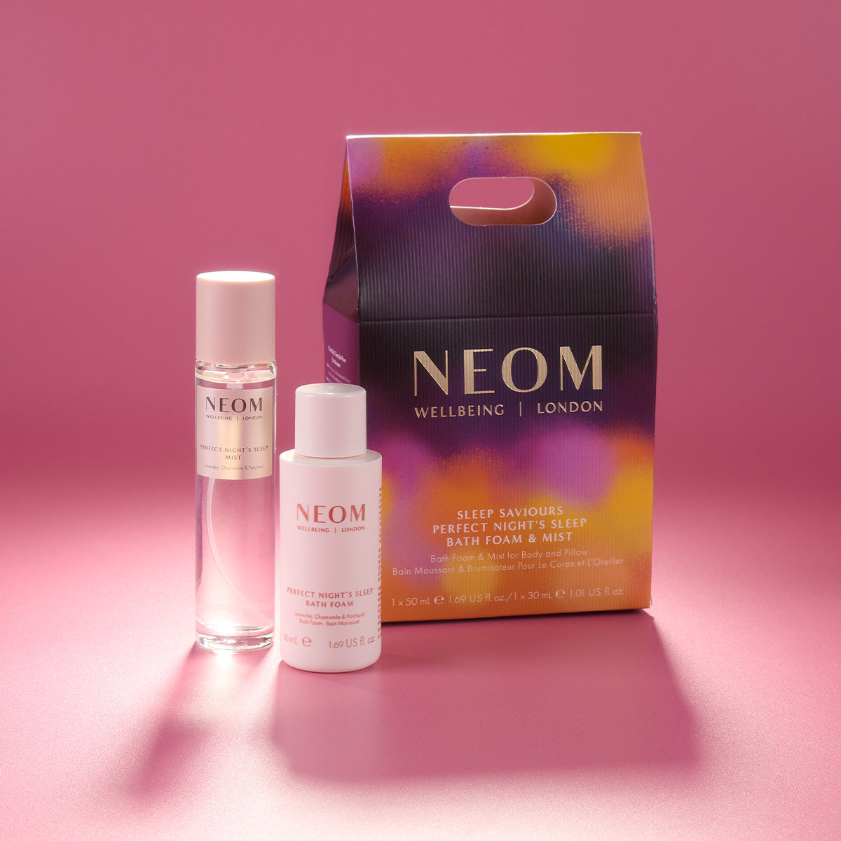 NEOM skincare products on a pink background